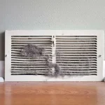 What Is That Grey Powder Accumulating On Your AC Vents Between Scheduled Cleanings?